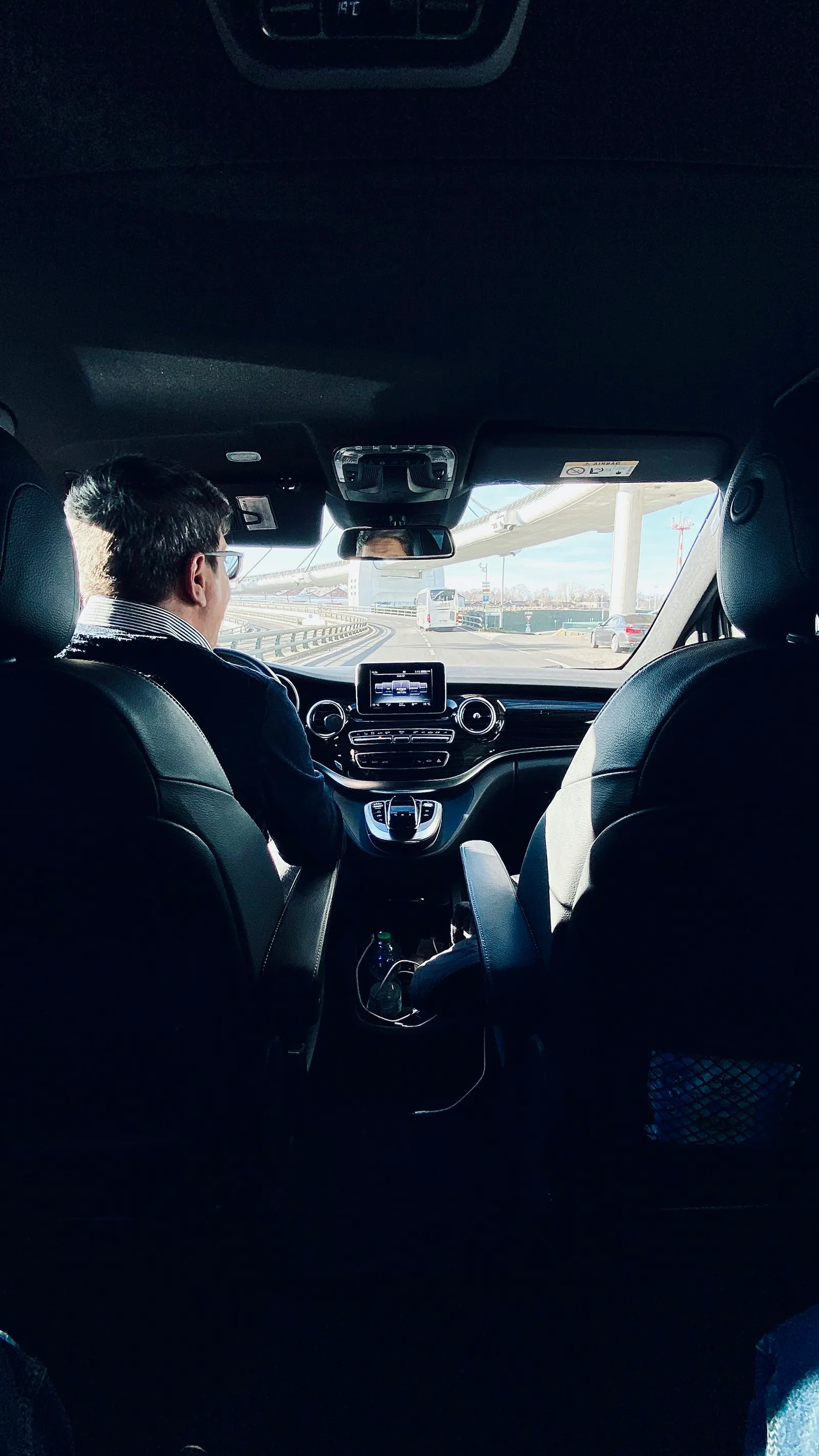 Driver inside a Mercedes during an airport transfer in Milan